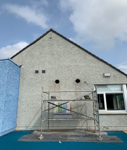 Building exterior showing three clean ventilation core holes