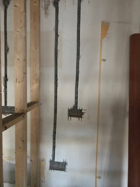 Wall chases with conduit and pipe installed