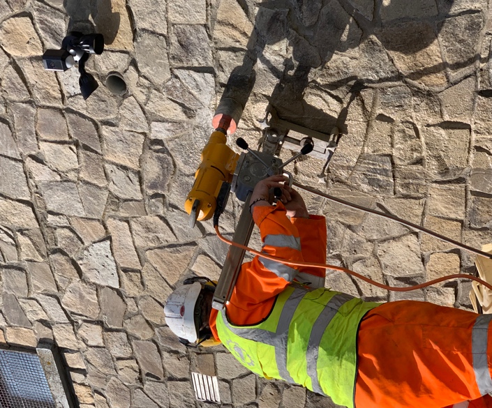 Core drilling operative on stone wall, Kildare
