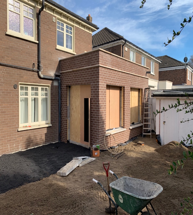 Large structural opening with Acrow props in brick wall