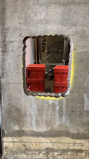 Small opening cut through rendered exterior wall