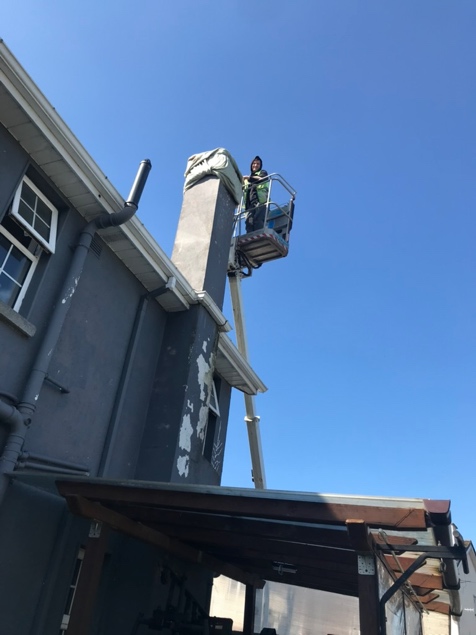Cherry picker access for chimney removal work