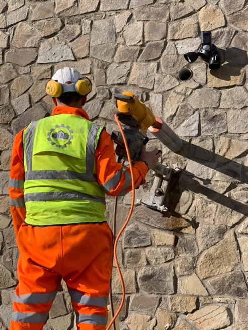 FB Coring operative drilling into stone wall, Kildare